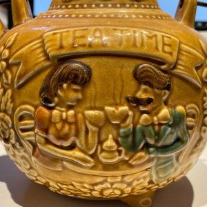 Art Deco "Tea Time" teapot mustard yellow made in japan wire handle